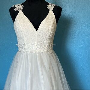 White gown for prom or formal wear.